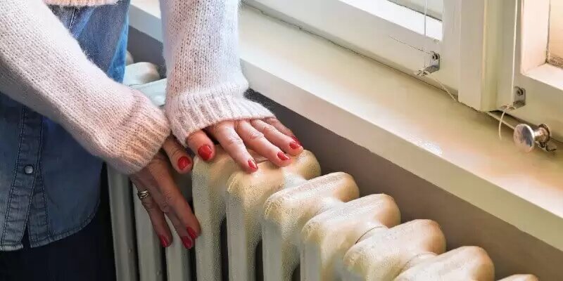 person checking radiator